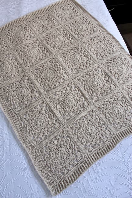 beige crochet blanket with vintage lace