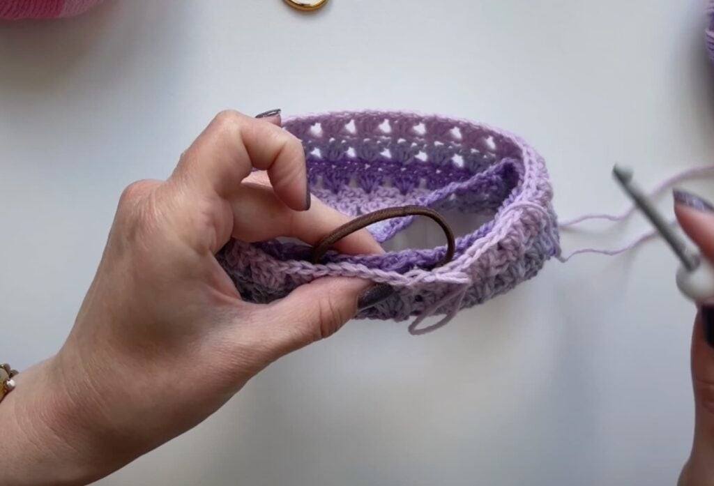 insert the hair band into the crochet scrunchie